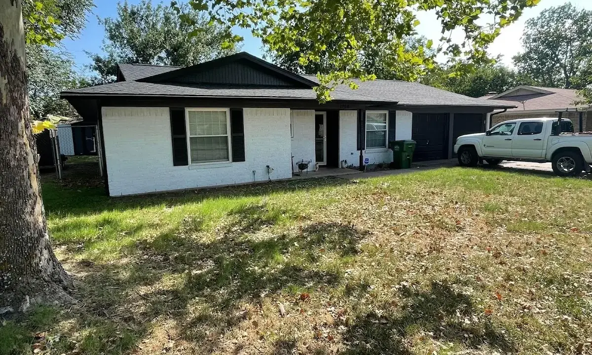 Professional roofing crew working on a residential roof in Maryland Heights
